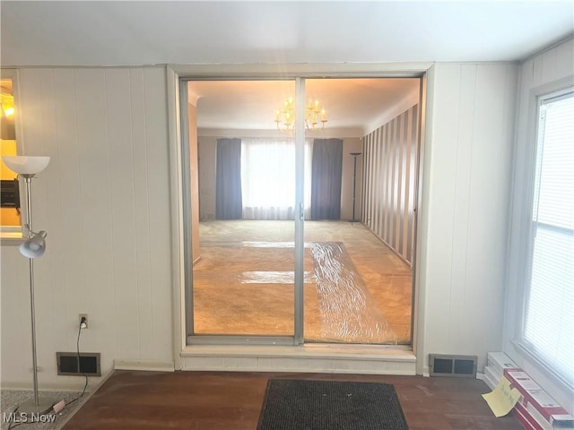 interior space with hardwood / wood-style flooring and a chandelier