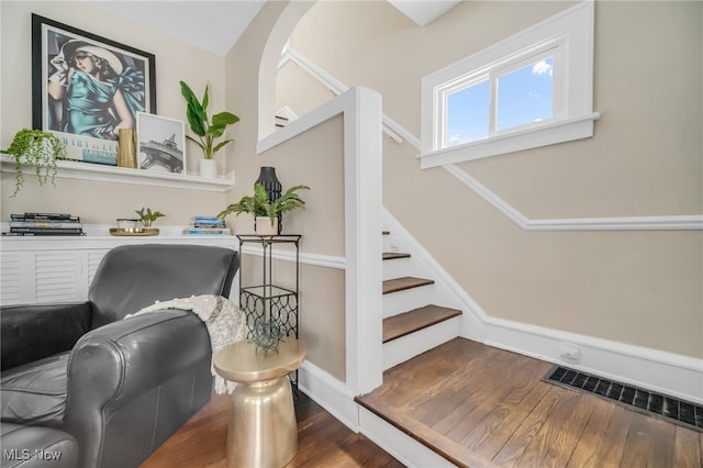 stairs with hardwood / wood-style flooring