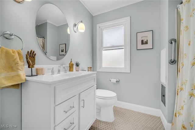 bathroom featuring toilet, vanity, tile patterned floors, and crown molding