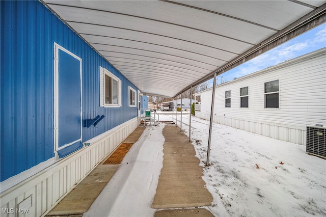 snow covered property featuring cooling unit