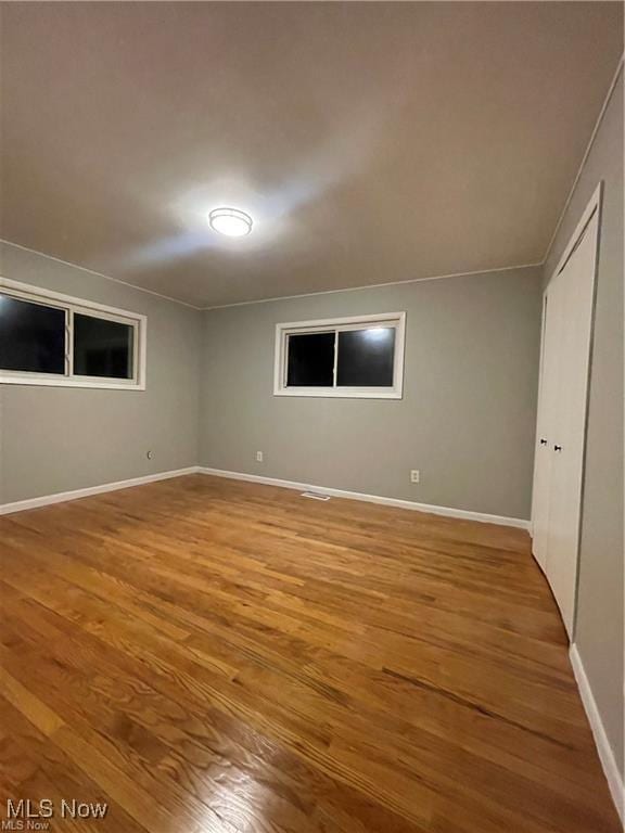 unfurnished bedroom with wood-type flooring