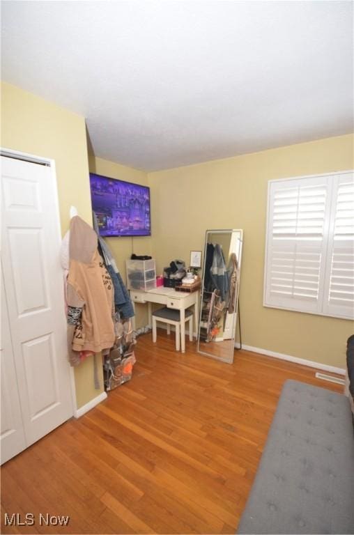 home office with hardwood / wood-style floors