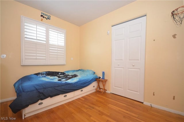 bedroom with light wood-type flooring