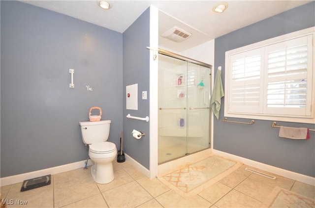 bathroom with tile patterned flooring, an enclosed shower, and toilet