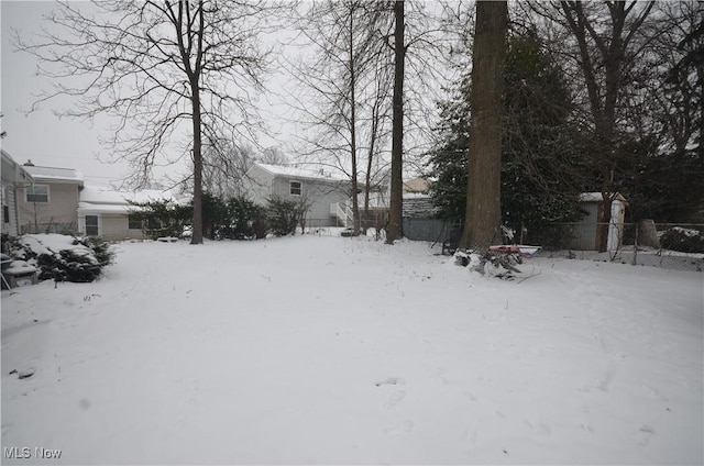 view of yard layered in snow