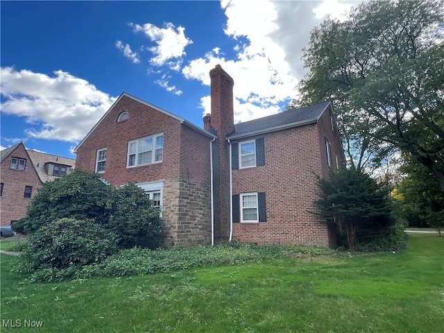 view of property exterior featuring a lawn