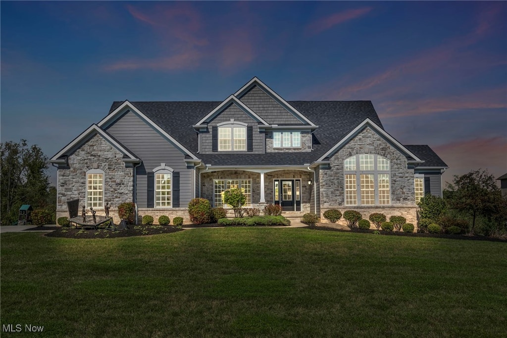 craftsman house featuring a lawn and covered porch