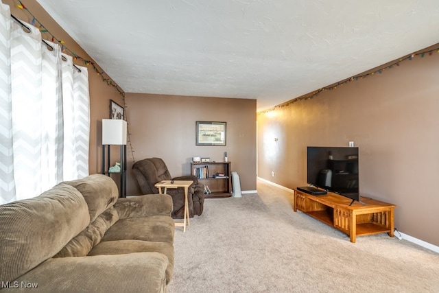 carpeted living room featuring a healthy amount of sunlight