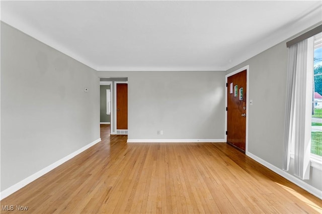 unfurnished room featuring light wood-type flooring