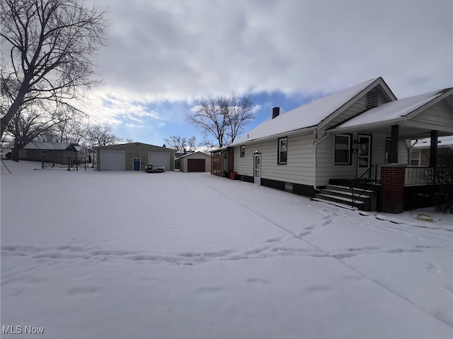 exterior space with an outbuilding and a garage