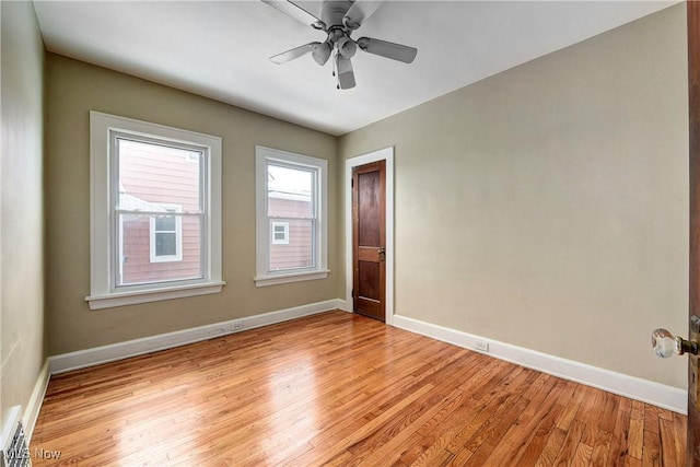 unfurnished room featuring ceiling fan and light wood-type flooring