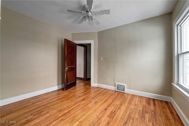 spare room featuring ceiling fan and light wood-type flooring