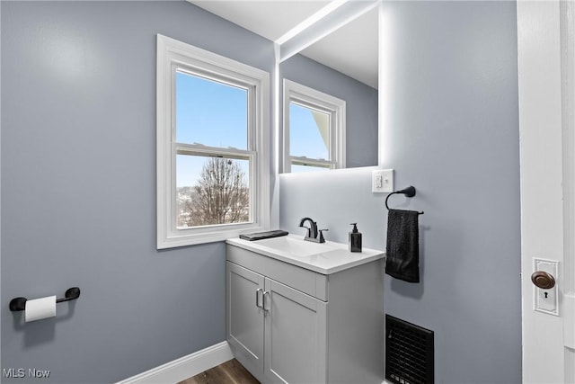 bathroom featuring hardwood / wood-style floors and vanity