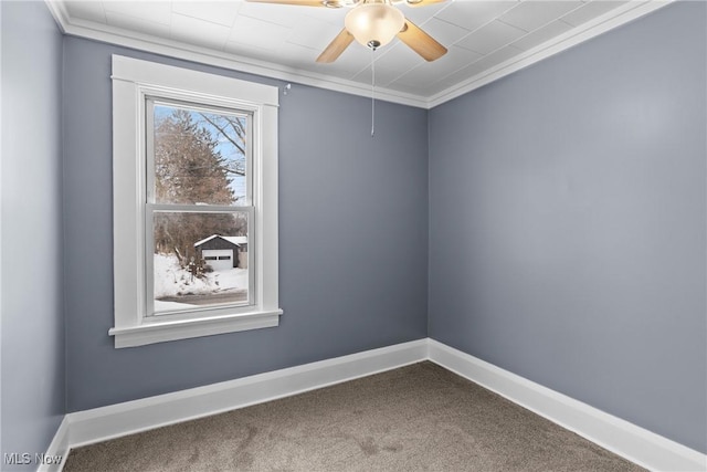 empty room with carpet flooring, ornamental molding, and ceiling fan