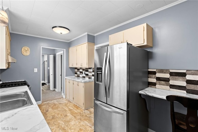 kitchen with stainless steel appliances, ornamental molding, backsplash, and sink