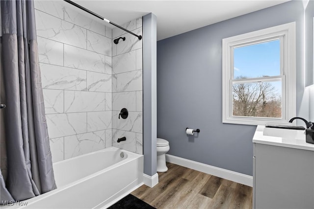 full bathroom with toilet, vanity, hardwood / wood-style flooring, and shower / bathtub combination with curtain