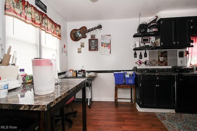 dining space with dark hardwood / wood-style floors