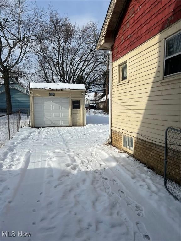 exterior space featuring a garage and an outdoor structure