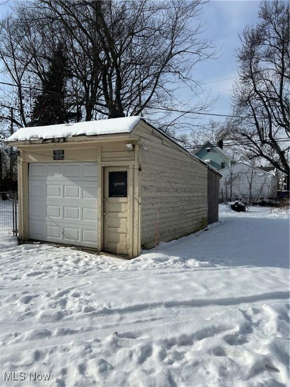 view of snow covered garage