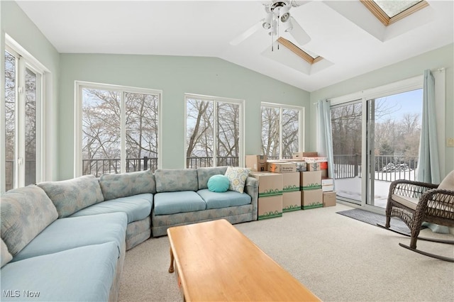 sunroom featuring ceiling fan and lofted ceiling