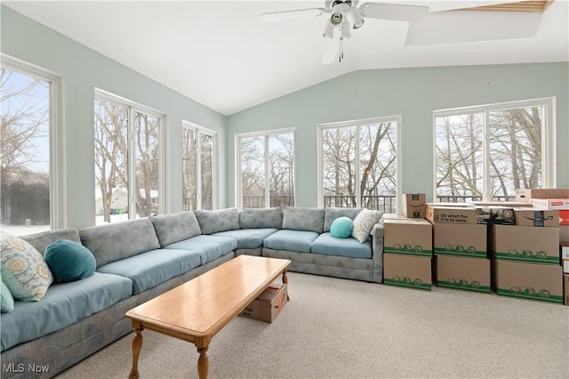 sunroom with ceiling fan and vaulted ceiling