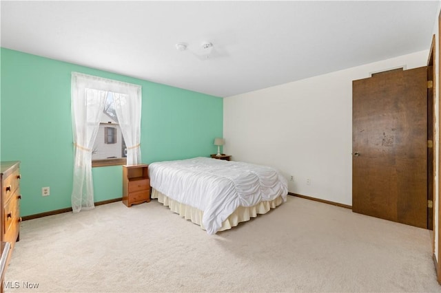 bedroom with light colored carpet