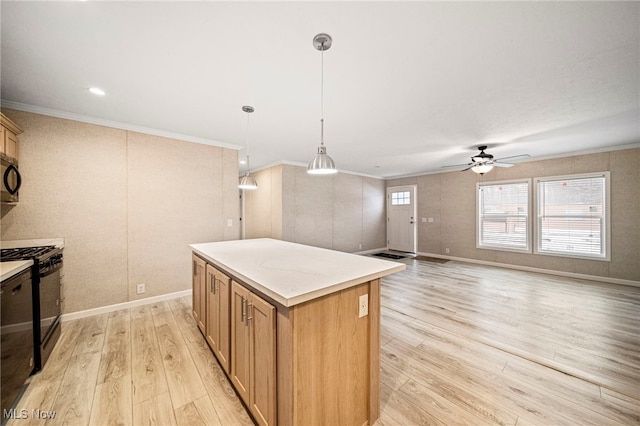 kitchen with pendant lighting, crown molding, black appliances, a kitchen island, and light wood-type flooring