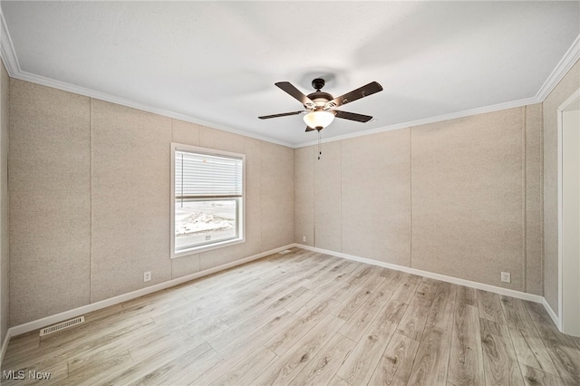 unfurnished room with crown molding, light hardwood / wood-style floors, and ceiling fan