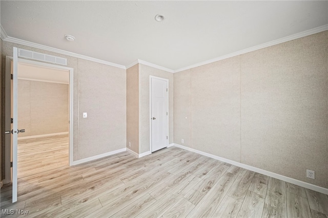 unfurnished bedroom featuring ornamental molding and light wood-type flooring