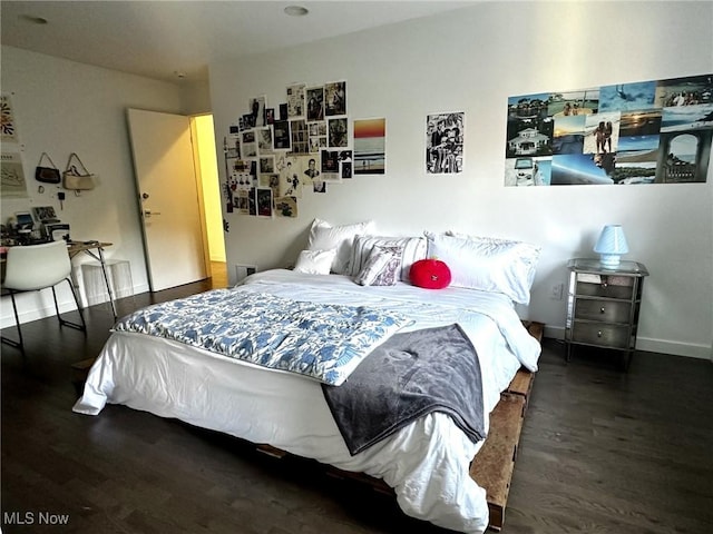 bedroom featuring dark hardwood / wood-style floors