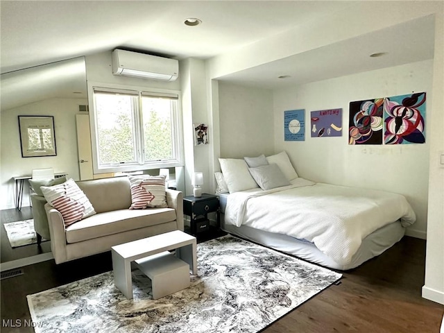 bedroom with a wall unit AC, lofted ceiling, and dark wood-type flooring