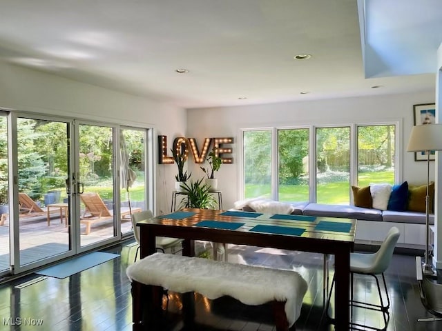 dining space featuring dark hardwood / wood-style flooring