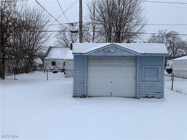 view of snow covered garage