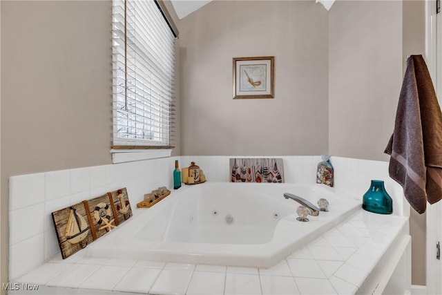 bathroom featuring tiled bath