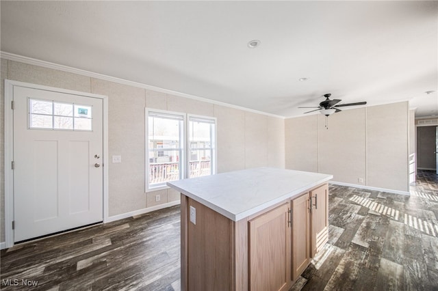 3583 Austin Rd Unit 134, Geneva, OH 44041 - kitchen with crown molding, a center island, plenty of natural light, and dark wood finished floors