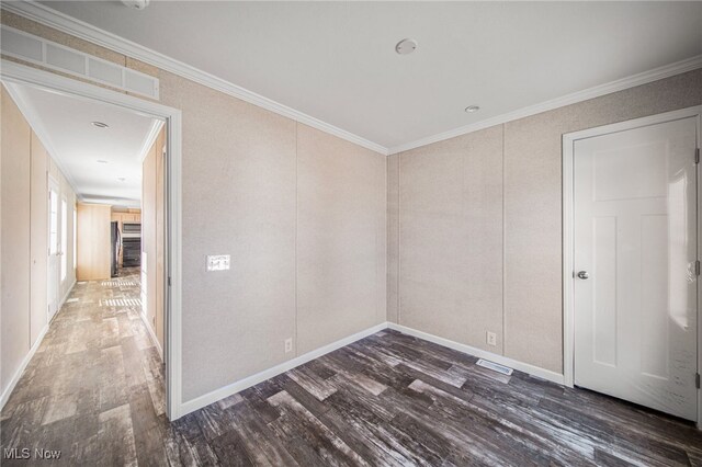 3583 Austin Rd Unit 134, Geneva, OH 44041 - spare room featuring crown molding, visible vents, and wood finished floors