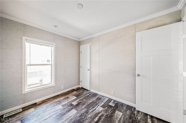 3583 Austin Rd Unit 134, Geneva, OH 44041 - unfurnished bedroom featuring crown molding, baseboards, dark wood-style floors, and visible vents