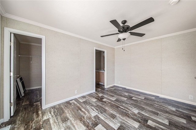 3583 Austin Rd Unit 134, Geneva, OH 44041 - unfurnished bedroom with a ceiling fan, dark wood-type flooring, a spacious closet, ornamental molding, and a closet