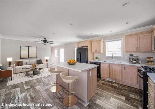 3583 Austin Rd Unit 134, Geneva, OH 44041 - kitchen featuring light brown cabinetry, a sink, black appliances, and dark wood-type flooring