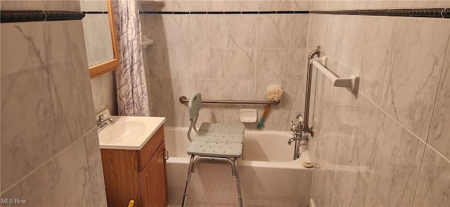 bathroom featuring vanity, tile walls, and shower / tub combo with curtain