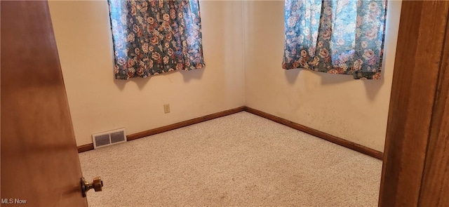 spare room featuring carpet flooring