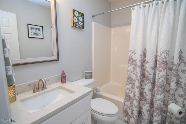 full bathroom featuring shower / bath combo, vanity, and toilet