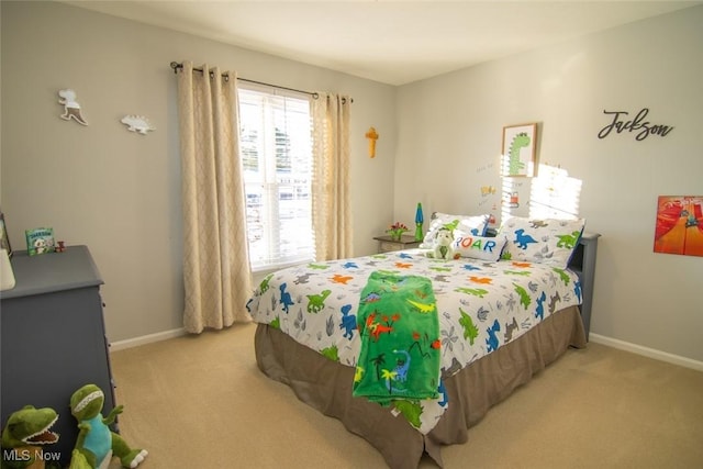 bedroom with light colored carpet