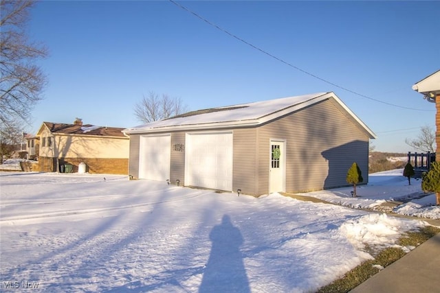 view of snow covered garage