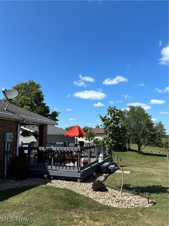 view of yard featuring a wooden deck