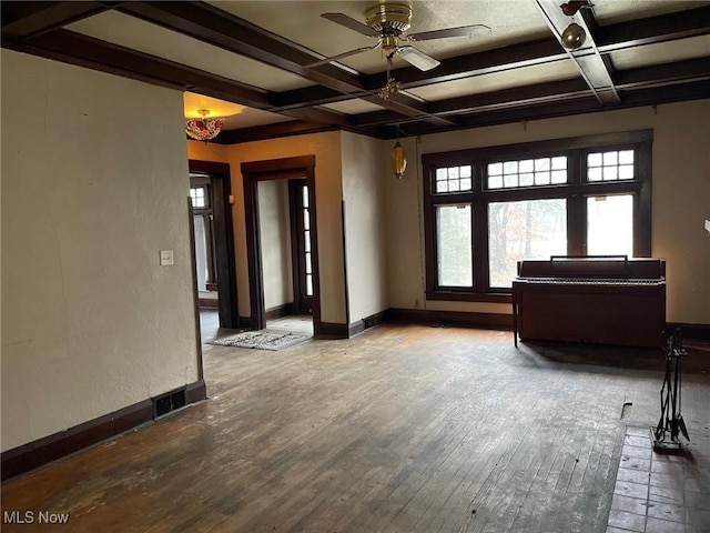 interior space featuring coffered ceiling, hardwood / wood-style flooring, and beamed ceiling