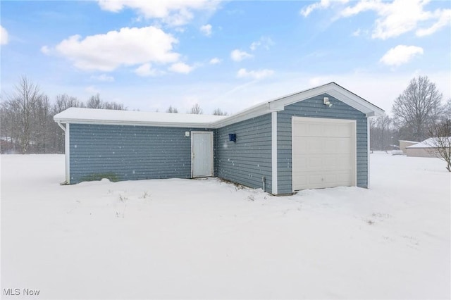 view of snow covered garage