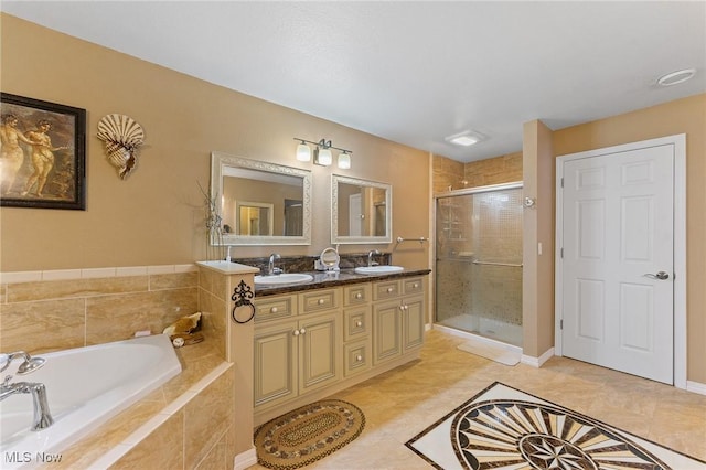 full bath featuring double vanity, a sink, a bath, and a shower stall