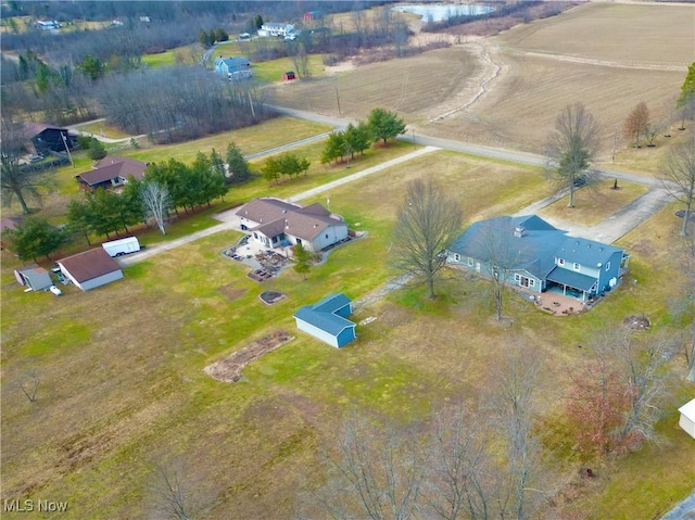 birds eye view of property with a rural view