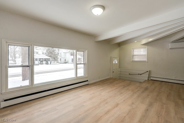 spare room featuring baseboard heating, a wall mounted AC, lofted ceiling with beams, and light hardwood / wood-style flooring